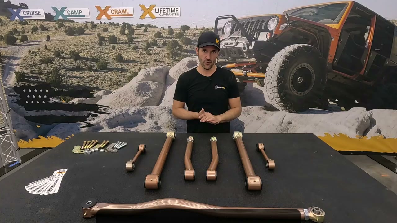 Core 4x4 seven-piece Camp Series rear suspension kit for the GMT800 platform laid out on a table: upper and lower adjustable control arms, adjustable track bar, sway bar end links, and hardware