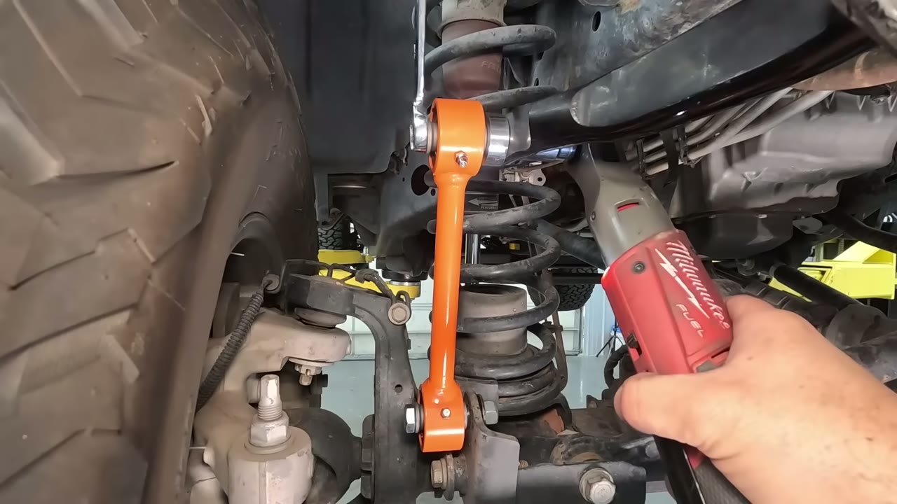 Installing the Core 4x4 Crawl Series end link between the sway bar and axle on the JL Wrangler